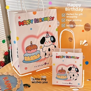 Detail of two cartoon dog gift bags in different sizes with rope handles for birthdays