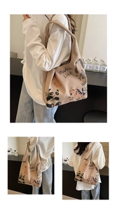 Detailed side view of tote bag featuring cartoon animal illustrations and shoulder strap