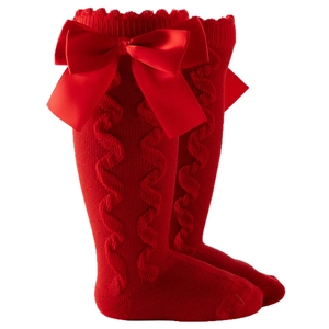 Red knee-high girls socks with cable knit texture and satin bows for lolita style