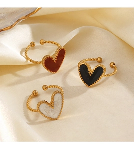 Detailed shot of 18K gold plated heart rings with colorful enamel and twisted rope bands