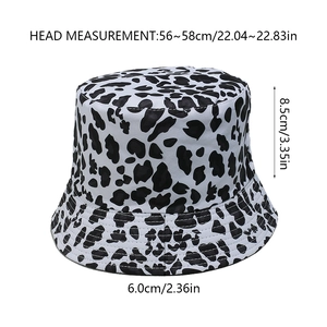 Detail showing bucket hat measurements with head circumference 56-58cm in cow print fabric