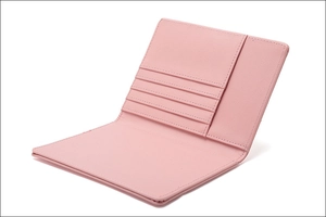 Detail view of pink RFID leather passport holder showing inner card slots and stitching