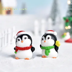 Miniature Christmas penguin figurines with Santa hats and scarves for DIY holiday decor