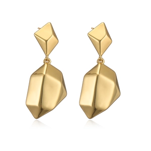 Macro shot of 18K gold plated heart earrings with geometric facets on white background