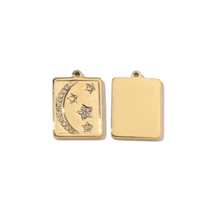 Detailed view of square gold pendants with moon, star motifs and rhinestone inlay