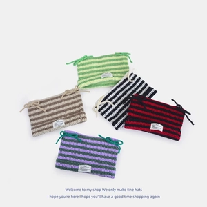 Striped knit beanie hats with devil ears and decorative ties in various colors
