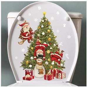 Detail showing Santa Claus and snowman festive stickers on a white toilet lid cover