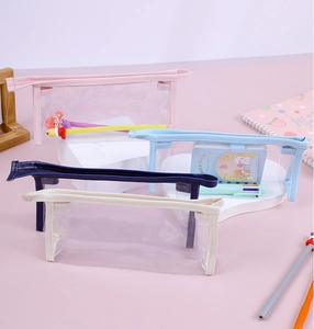 Detail view of four large-capacity transparent PVC pencil cases in various colors