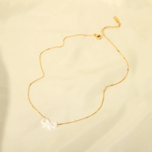 Elegant 18k gold-plated stainless steel necklace featuring a white pearl bow pendant