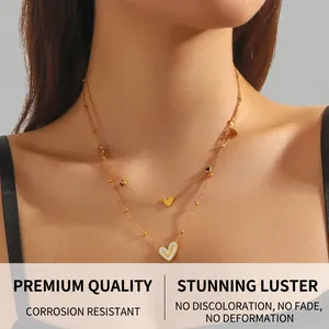 Close-up of double-layer gold plated stainless steel necklace with heart pendants