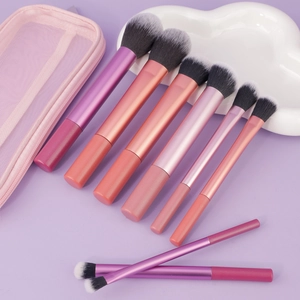 Set de 9 pinceaux de maquillage avec manches dégradés et trousse en filet rose