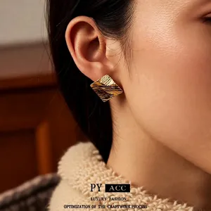 Luxury 18k gold plated rhombus stud earrings with elegant textured wave pattern