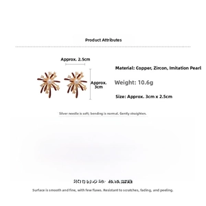 Macro view showing fireworks-shaped stud earrings with zircons and faux pearls