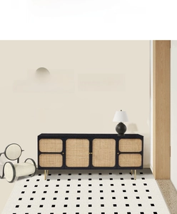Detail of French minimalist black and white checkered floor mat in elegant home entryway