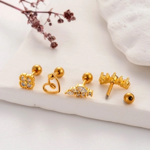 Gold stainless steel heart and clover screw back earrings set on elegant stone display