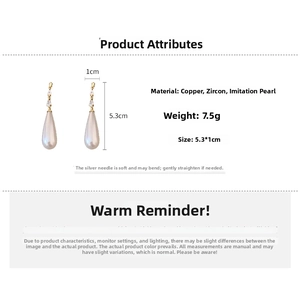 Detail view of gold-plated drop earrings with pearls showing 5.3cm length measurement