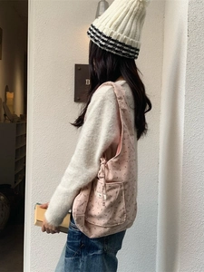 Pink floral corduroy tote bag with side drawstring and front pocket for women