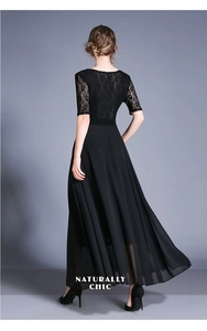 Back view of a chic black lace chiffon maxi dress with high waist and elegant flowy skirt
