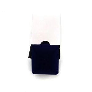 Detail of dark blue velvet jewelry box and white protective paper outer sleeve