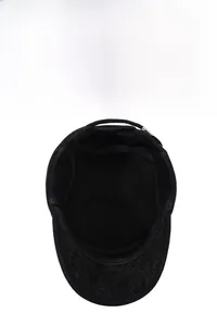 Close-up of black wool flat top military cap with thick fleece lining and ear flaps