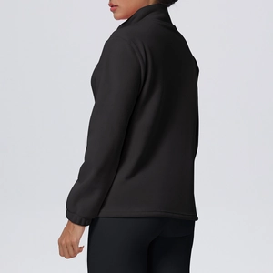 Detail of the windproof stand collar and high-elastic fabric on a black athletic jacket