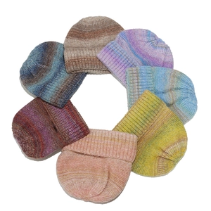 Colorful tie-dye gradient knitted beanies in space-dyed wool blend for winter