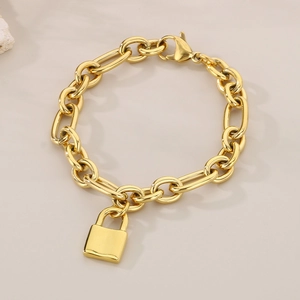 Detail of a gold hip-hop padlock pendant bracelet with polished oval chain links