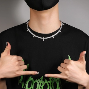 Hip hop silver spike tennis necklace with sparkling zircons shown on male model neck