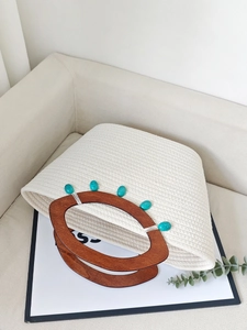 Chic beige woven tote bag with turquoise beads and brown wooden ring handles