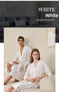 Detailed view of the white 3D grid waffle texture on a long-length breathable bathrobe