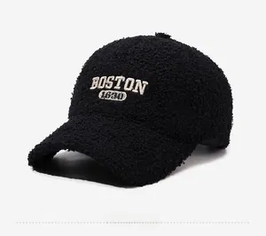 Detailed close-up of BOSTON 1630 embroidery on black fleece teddy baseball cap