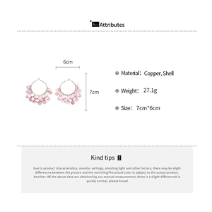 Pink shell fringe hoop earrings featuring copper frame details and size measurements