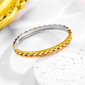 Three-tone industrial gear style stainless steel bracelet with scalloped wave edges