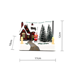 Detailed snow-covered Christmas cottage scene with Santa Claus and LED lights