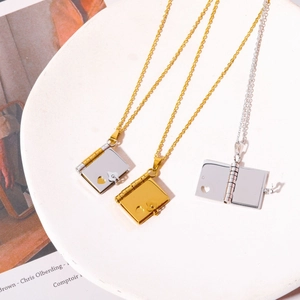 Minimalist stainless steel book pendant necklaces in gold and silver with heart cutouts
