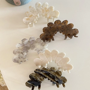 Elegant acetate petal hair claws in marble and tortoiseshell patterns for women