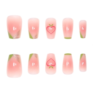 Pink gradient French press-on nails with peach heart accents and gold glitter details