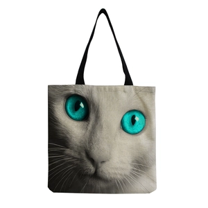 Detailed view of large canvas tote bag showing thick cotton linen fabric and cat print