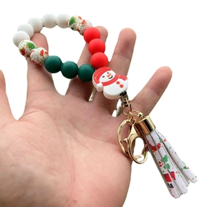 Christmas silicone bead bracelet keychain with snowman pendant and festive tassel detail