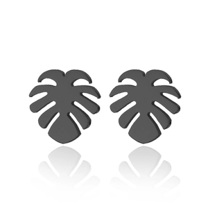 Detail of matte black monstera leaf earrings with intricate hollow-cut steel design