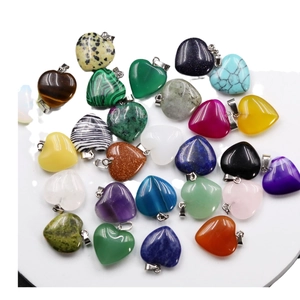 Mix of heart-shaped stone pendants with silver metal clasps on a white background