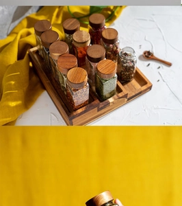Kitchen organizer with 12 square glass spice jars and a wooden rack for storage