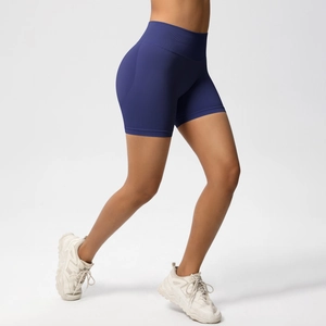 Detail of high waisted seamless biker shorts in navy blue with a peach lift effect