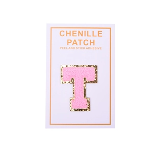 Detail of pink chenille letter T patch with gold glitter border and self-adhesive backing