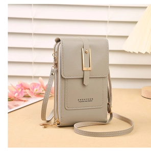 Detail view of grey PU leather crossbody phone bag with gold metal buckle and zipper layers