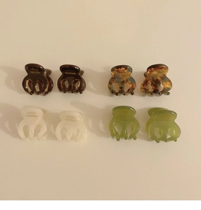 Close-up of acetic acid mini hair claws in tortoiseshell and solid colors for styling