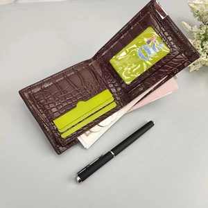 Detail view of brown crocodile texture wallet showing multiple card slots and internal layout