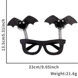 Halloween bat wing glasses frame with pom-poms and dimensions 23cm x 13.5cm