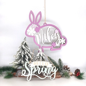 Detail of wooden Easter rabbit pendant with Miley name and Hello Spring banner