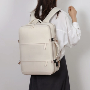Large ivory travel backpack with multi-layer zippers shown on a model side view